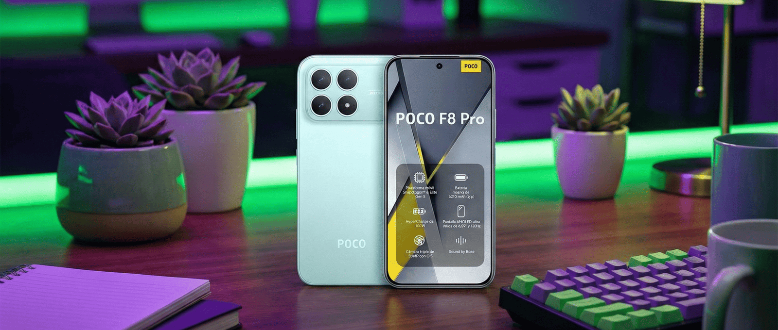 "Smartphone Xiaomi POCO F8 Pro color menta reposando sobre un escritorio de madera en un entorno de setup gamer con iluminación LED ambiental verde y morada, junto a periféricos y plantas suculentas."